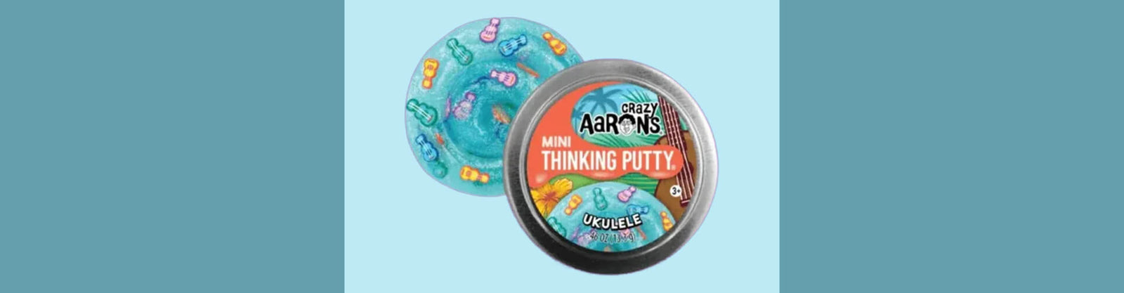 2 inch tin ukelele crazy aarons thinking putty on a teal background-fun fidgets 2 inch tin ukelele crazy aarons thinking putty on a teal background-fun fidgets