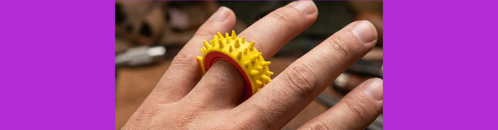 a textured sensory ring shown on a finger-fun fidgets a textured sensory ring shown on a finger-fun fidgets