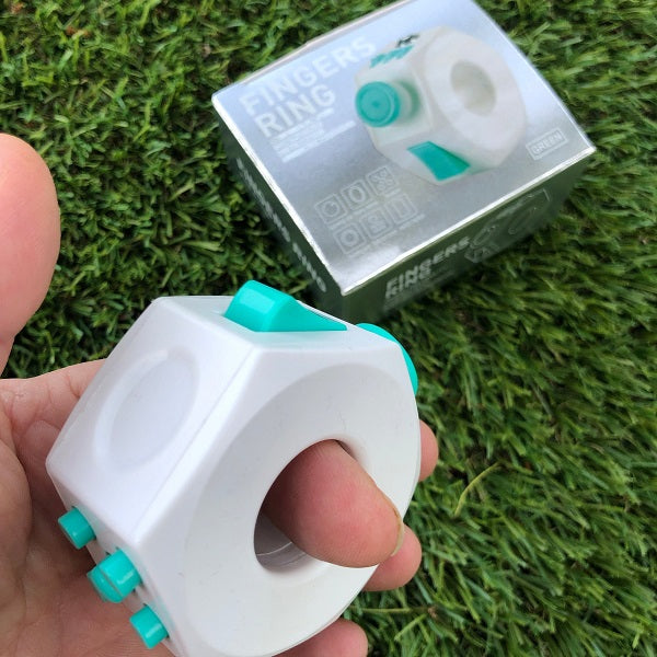 white fidget cube ring shown on finger-fun fidgets
