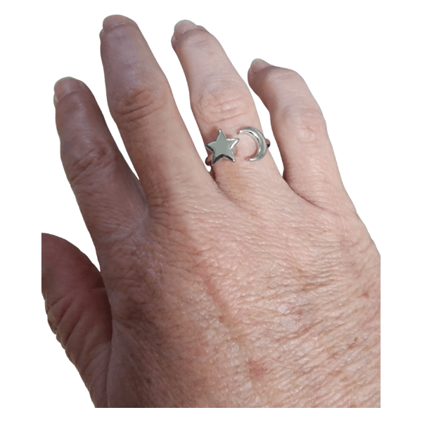 moon and star fidget ring shown on a finger-fun fidgets