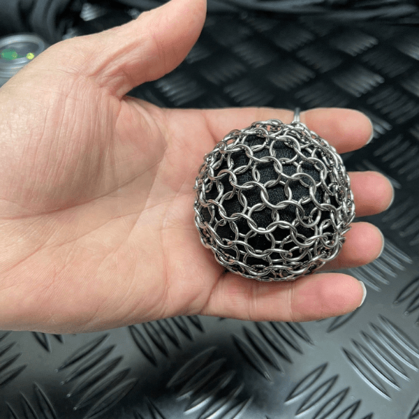 Chain Maille Ball - Firm Squish and Picking Support being rested in a hand-fun fidgets