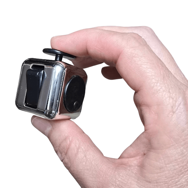 silver cube fidget held between 2 fingers-fun fidgets