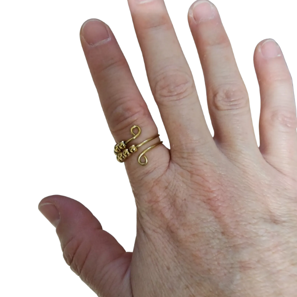 gold fidget ring shown on a finger-fun fidgets