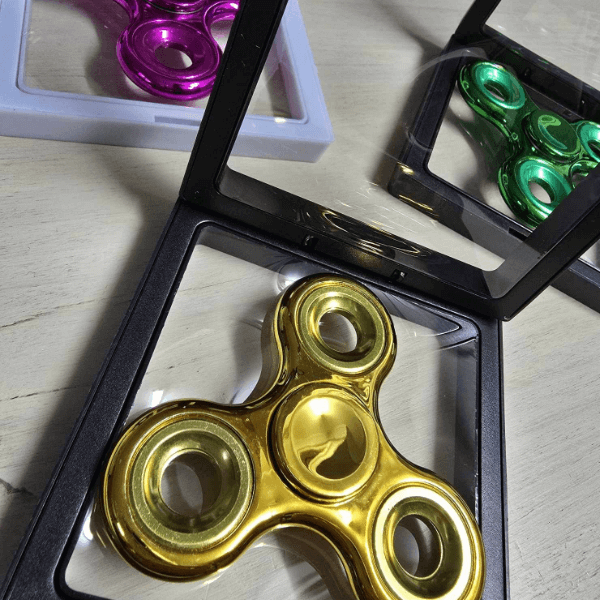 metallic fidget spinners shown in display box-fun fidgets