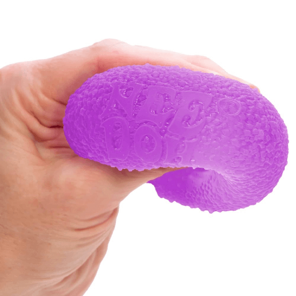 purple Nee Doh Gumdrop being squished-fun fidgets