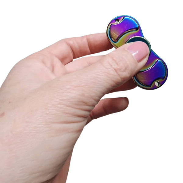 premium orbital spinner being  held between 2 fingers-fun fidgets