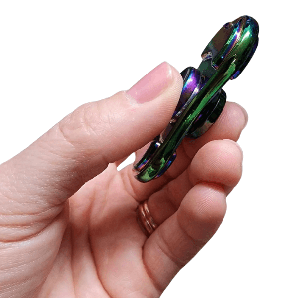 premium orbital spinner being  held between 2 fingers showing a side view-fun fidgets