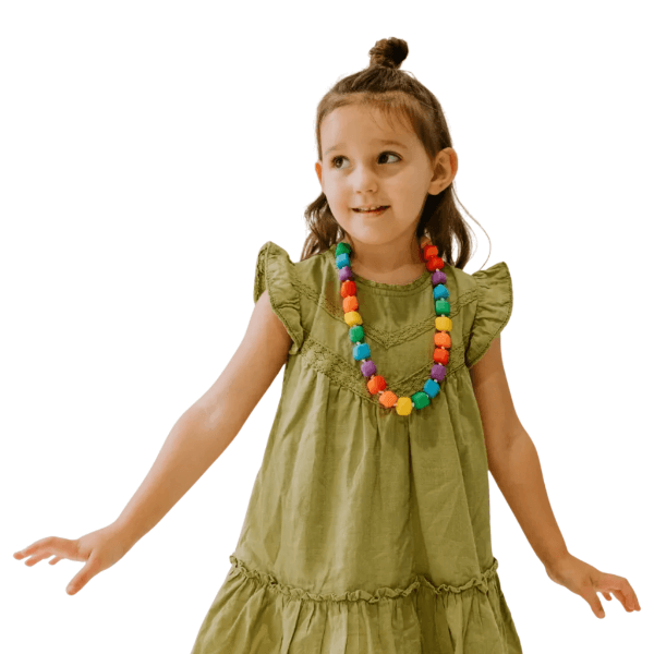 rainbow bright camo Princess and the Pea Chew Necklace shown worn around a child&#39;s neck-fun fidgets