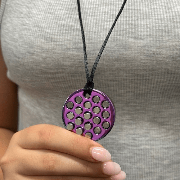 Rainstorm Necklace-Wearable Sensory Support shown hanging around a persons neck-fun fidgets