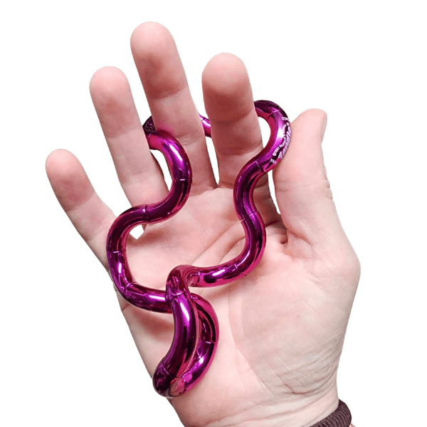 pink Tangle Jnr Metallic uncoiled in a hand-fun fidgets