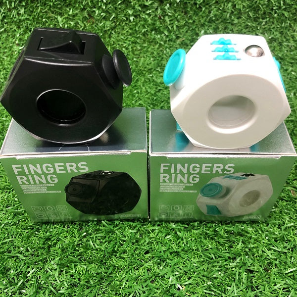 a black and a white fidget cube ring displayed on product boxes-fun fidgets