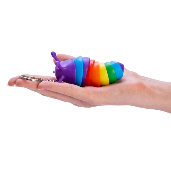 rainbow sensory slug keychain on a hand-fun fidgets